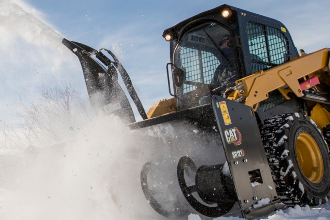 Skid steer loader with snow