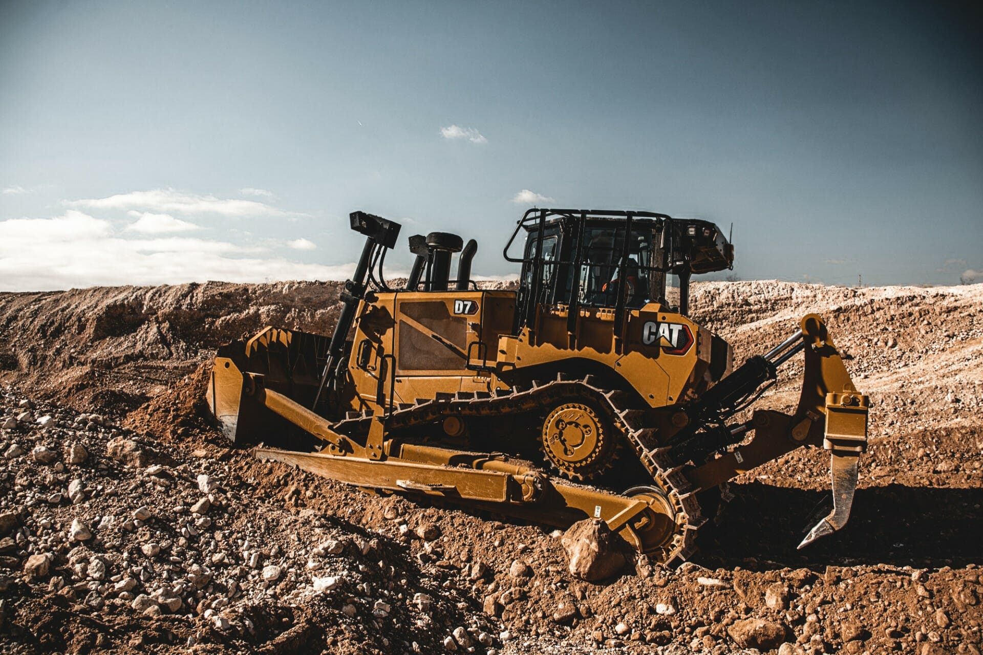 cat machine in the dirt