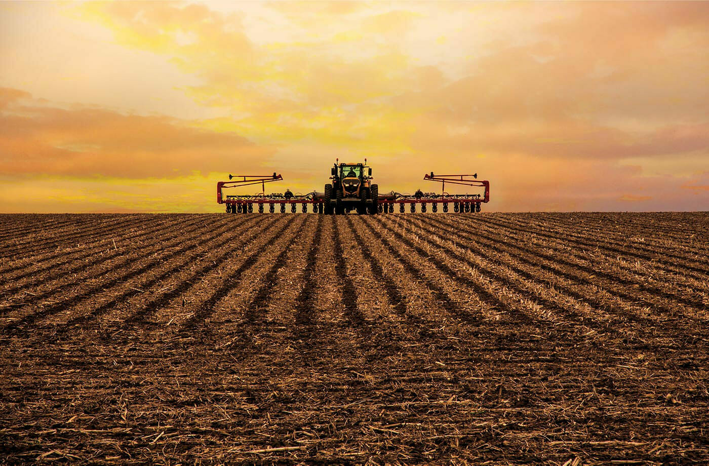 Challenger 1000 tractor at sunset