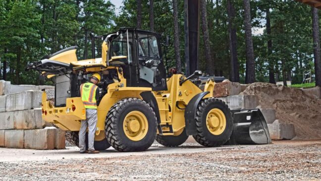 Cat equipment operator working on equipment