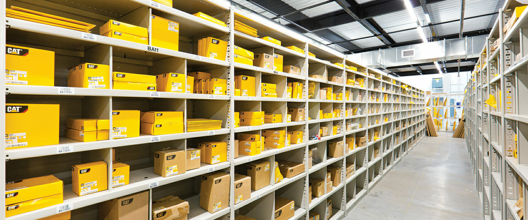 Cat Parts stacked on the shelf inside of a Ziegler Cat warehouse