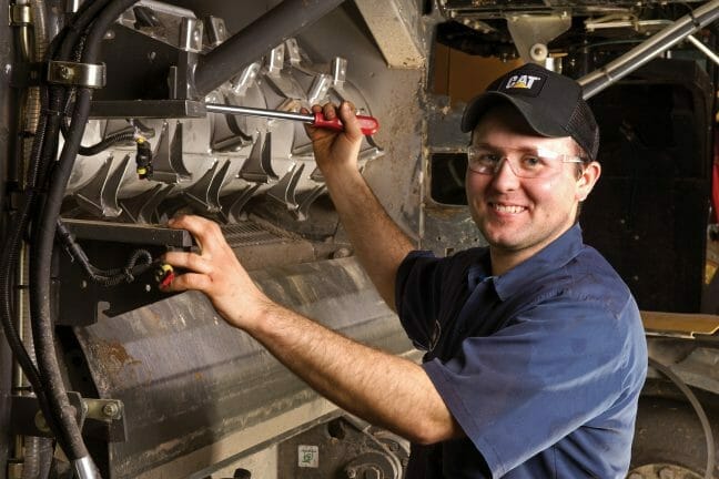 Service worker working on equipment