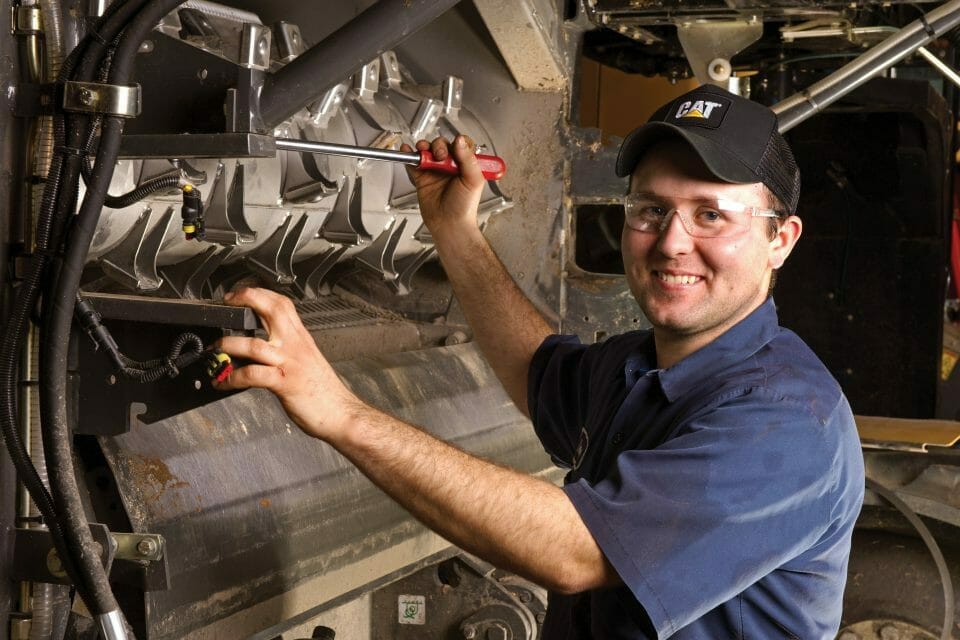 Service worker working on equipment