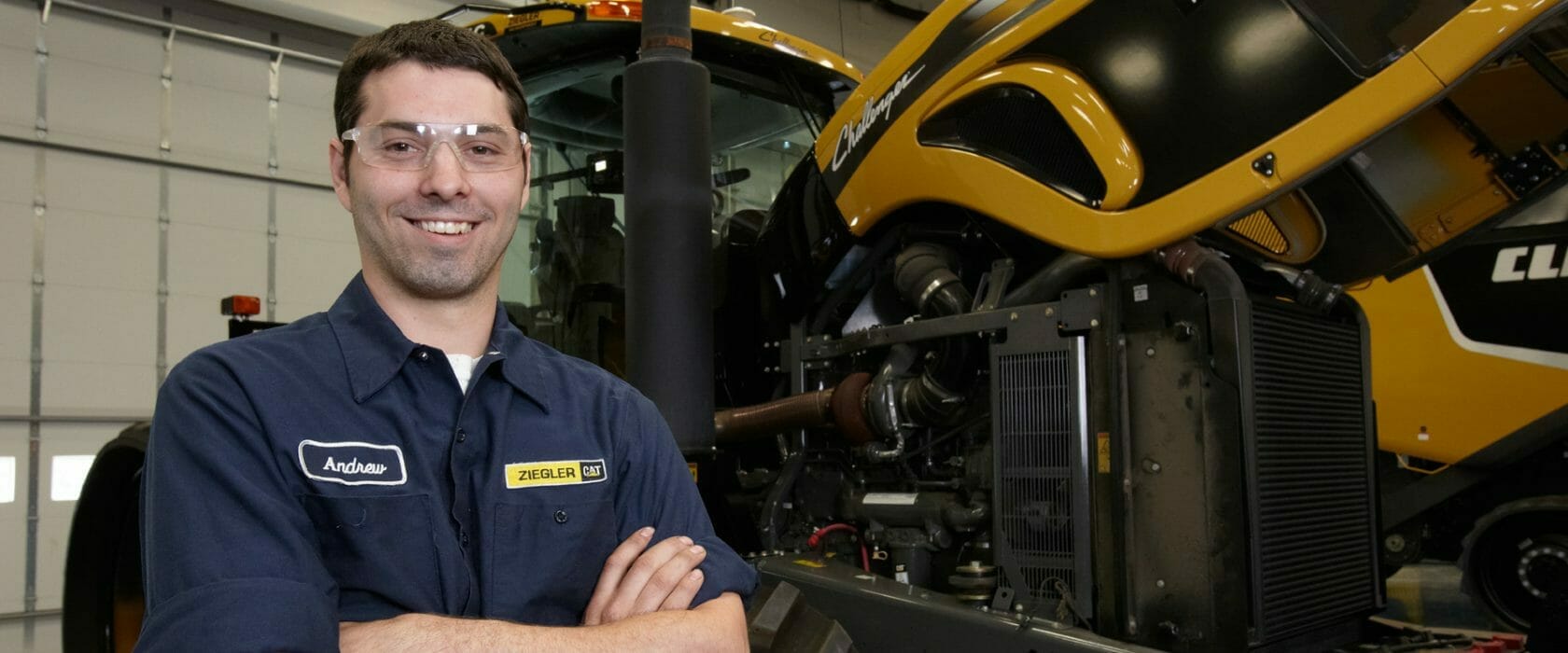 Employee standing next to used equipment