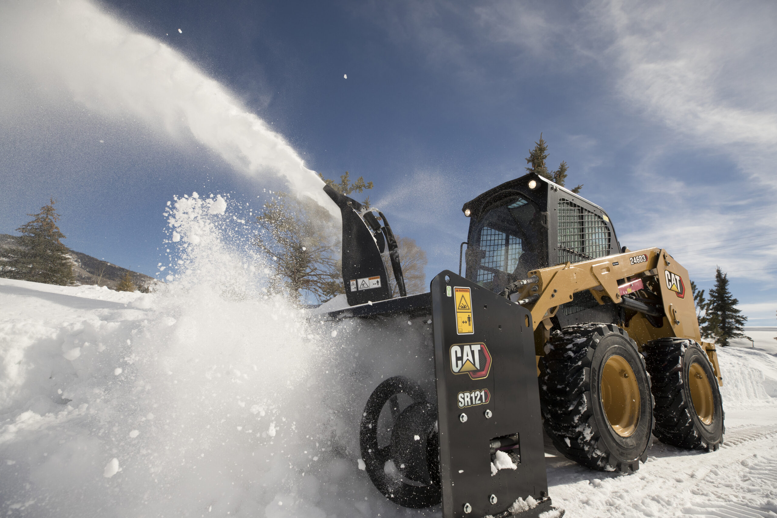 CAT machine in snow with durable attachments