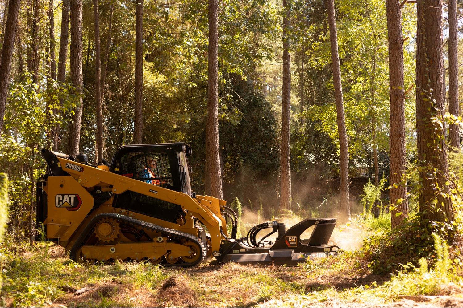 CAT machine with implement attached for logging work