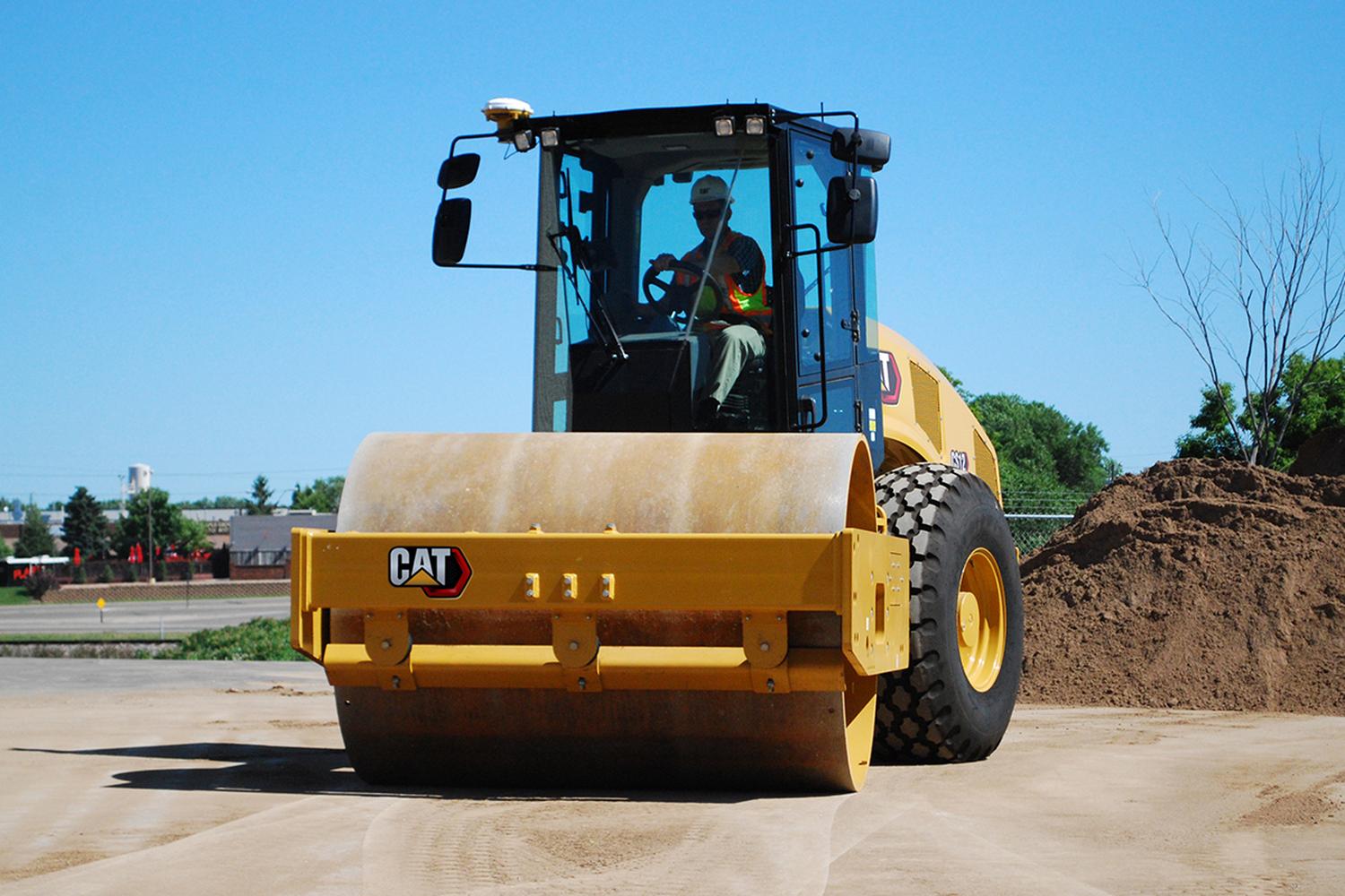 CAT-rent-compaction-equipment Compact rented CAT compaction equipment on a dirt road