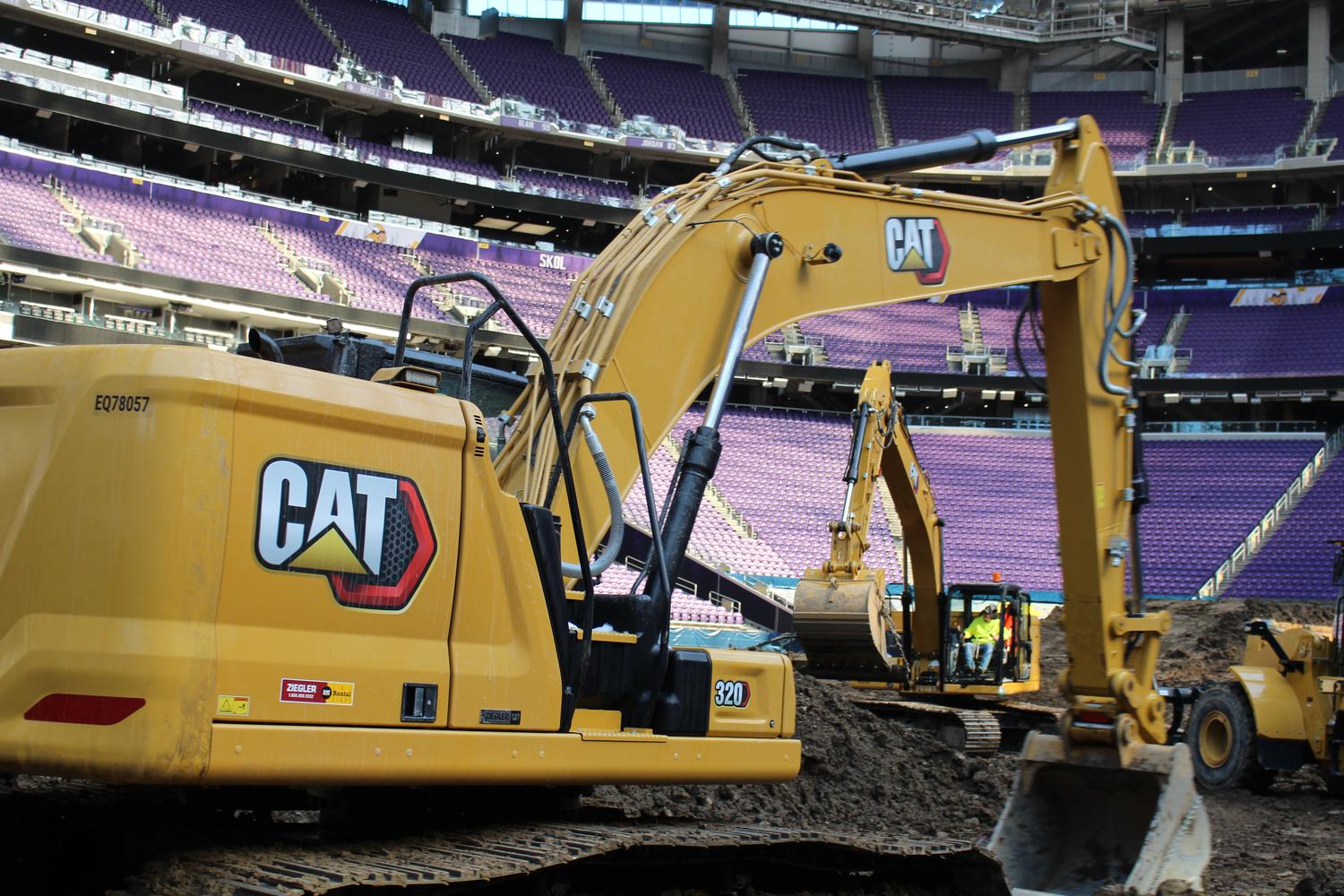 Large-CAT-exavator-working-at-a-dig Large CAT excavator working on a commercial job site
