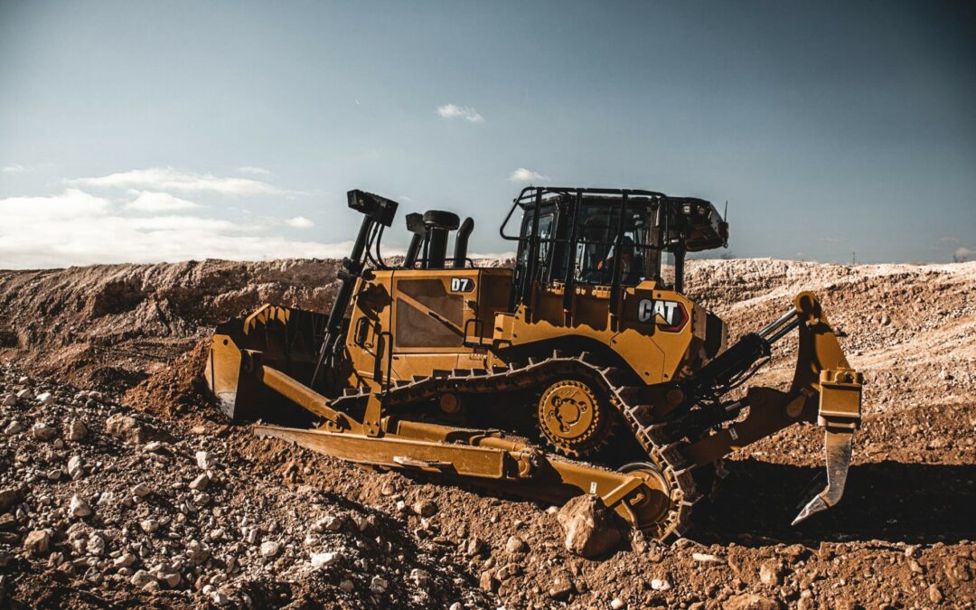 cat machine in the dirt