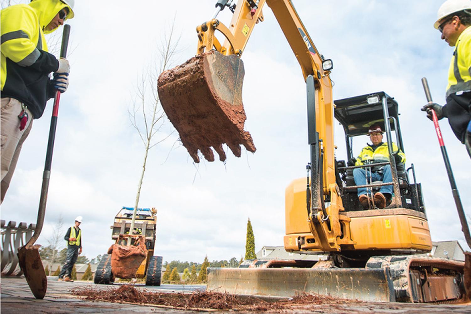 Medium-landscaping-CAT-excavator-job-site Small CAT excavator digging at a rental job site