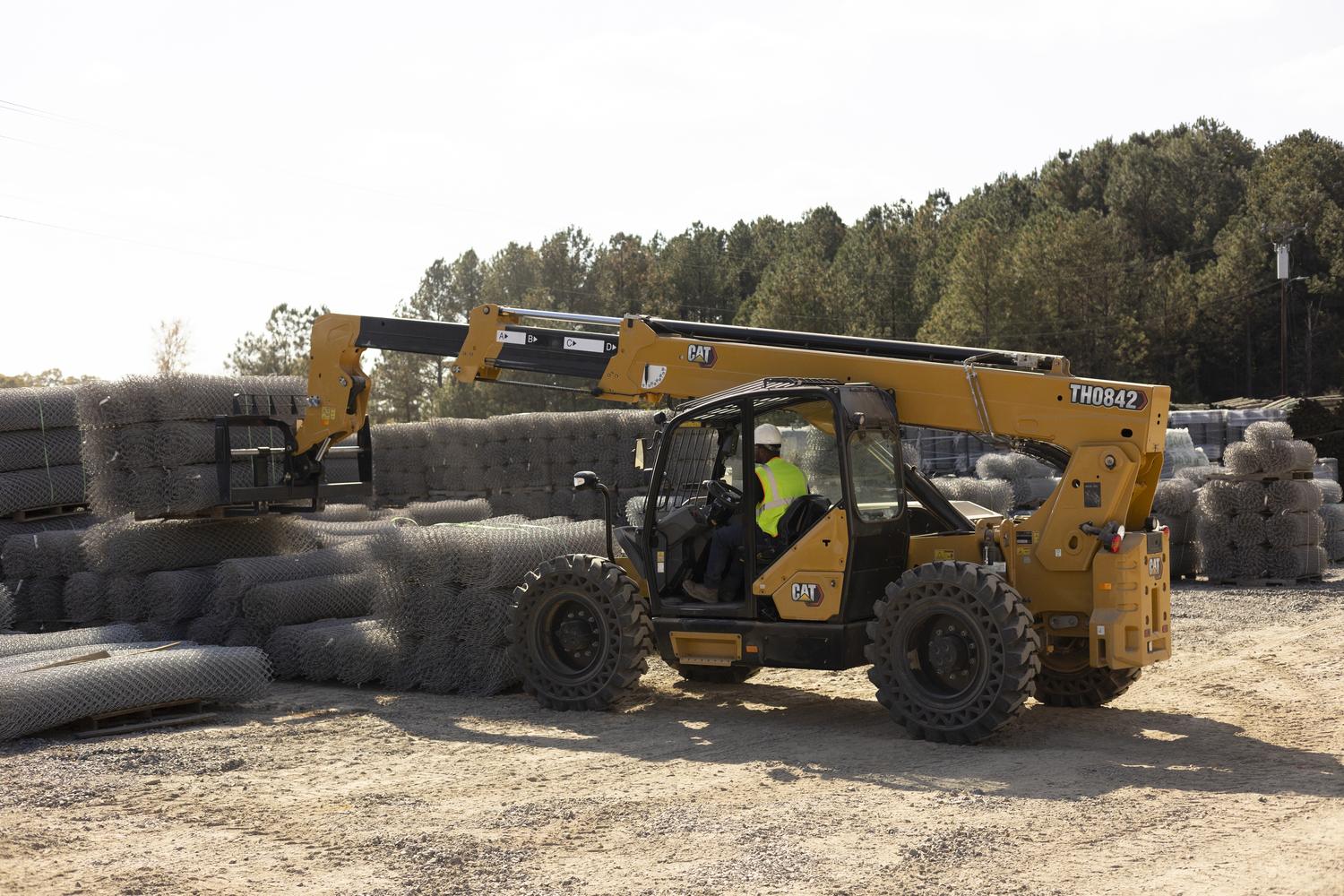 extended-reach-telehandler-rented large rented telehandler working on a commercial job site
