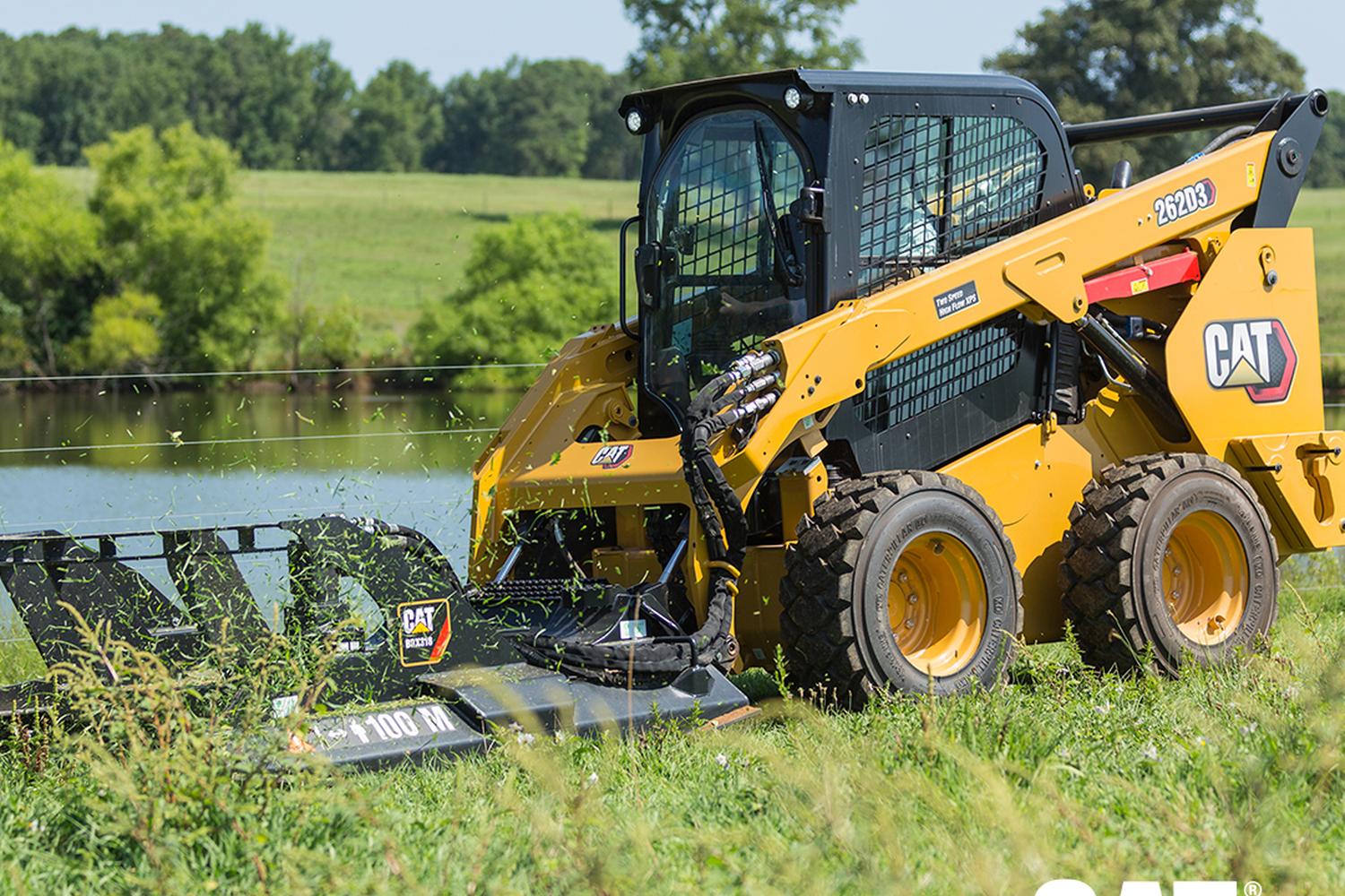 Smaller rented CAT machine for grass mowing