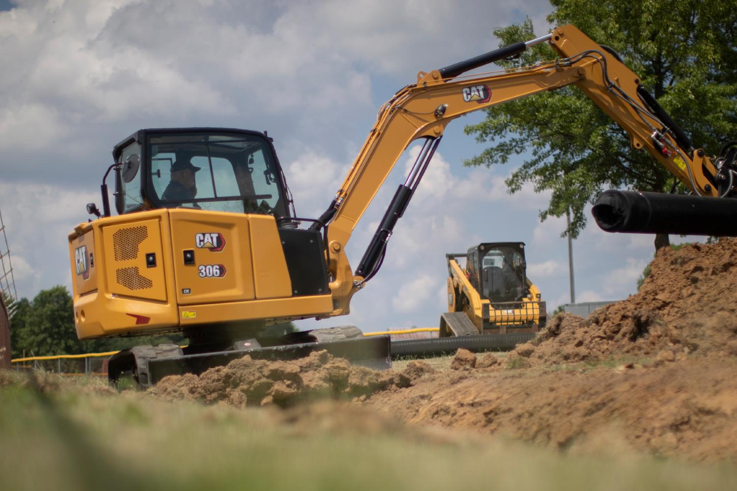 medium-CAT-excavator-at-a-job-site A medium CAT excavator working at a job site