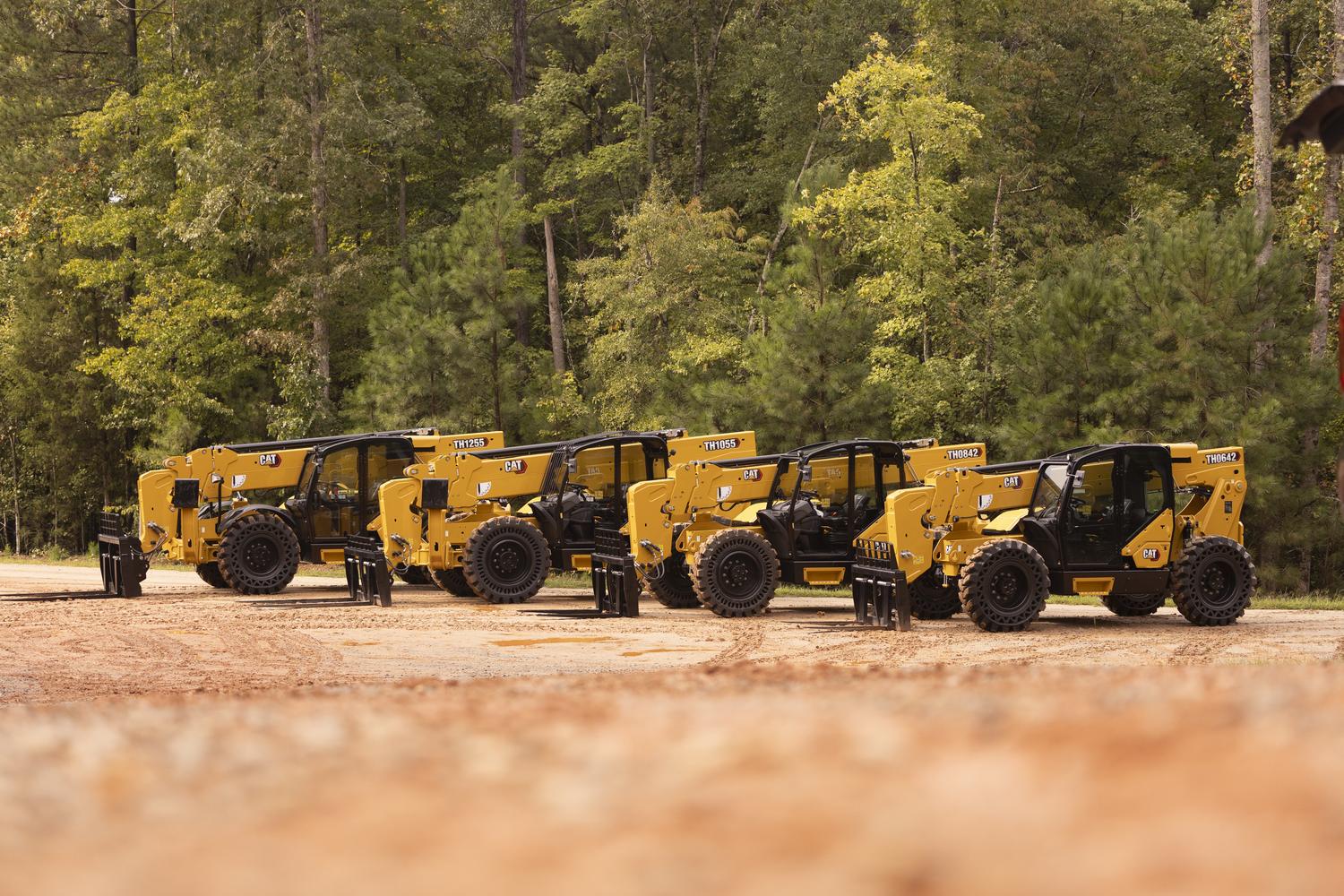 rent-telehandlers-for-commercial-projects Row of rented telehandlers from CAT